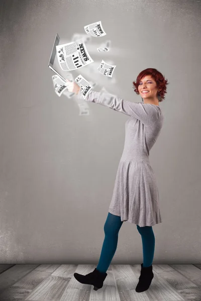 Casual young woman holdin notebook and reading the explosive new — Stock Photo, Image