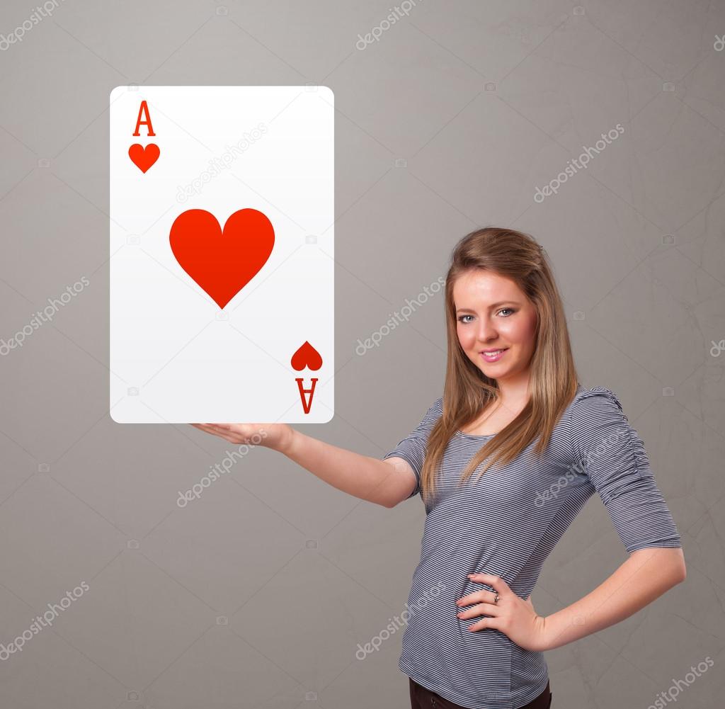 Beautifu woman holding a red heart ace