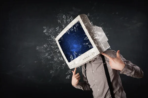 Computer monitor screen exploding on a young persons head — Stock Photo, Image