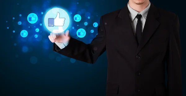 Handsome person pressing thumbs up button on modern social netwo — Stock Photo, Image