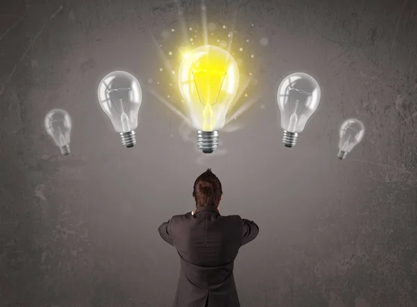 Business person having an idea light bulb concept — Stock Photo, Image