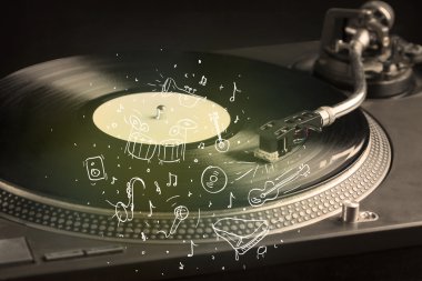 Turntable simge çizilmiş enstrümanlarla klasik müzik çalıyor 
