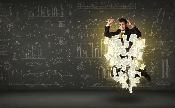 Hombre de negocios guapo saltando con la nube de documentos de papel — Foto de Stock