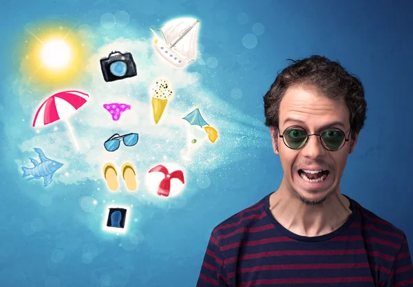 Happy joyful man with sunglasses looking at summer icons — Stock Photo, Image