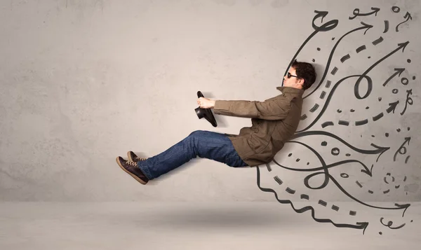 Funny man driving a flying vehicle with hand drawn lines after h — Stock Photo, Image