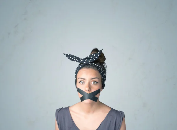 Young woman with glued mouth — Stock Photo, Image