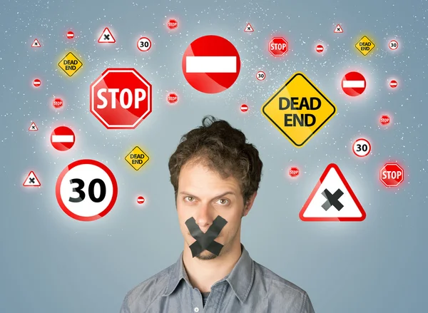 Young man with glued mouth and traffic signals — Stock Photo, Image