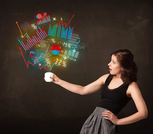 Businesswoman holding a white cup with diagrams and graphs — Stock Photo, Image