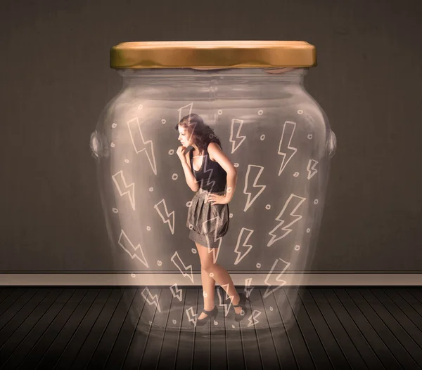 Businesswoman inside a glass jar with lightning drawings concept — Stock Photo, Image