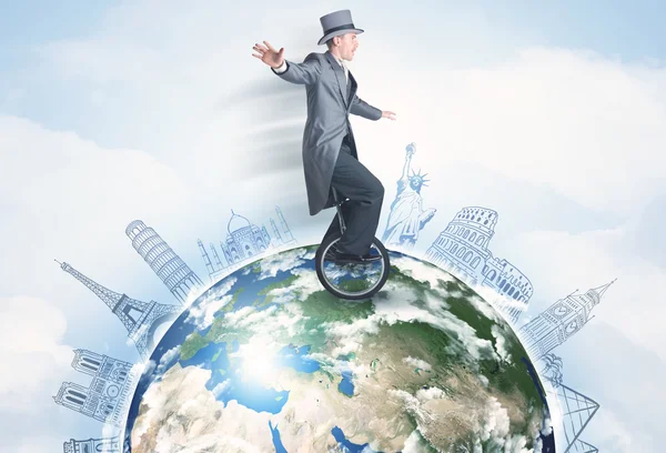 Man rijden eenwieler over de hele wereld met grote steden — Stockfoto