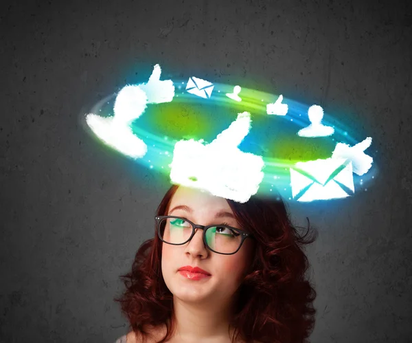 Young teenager with cloud social icons around her head — Stock Photo, Image