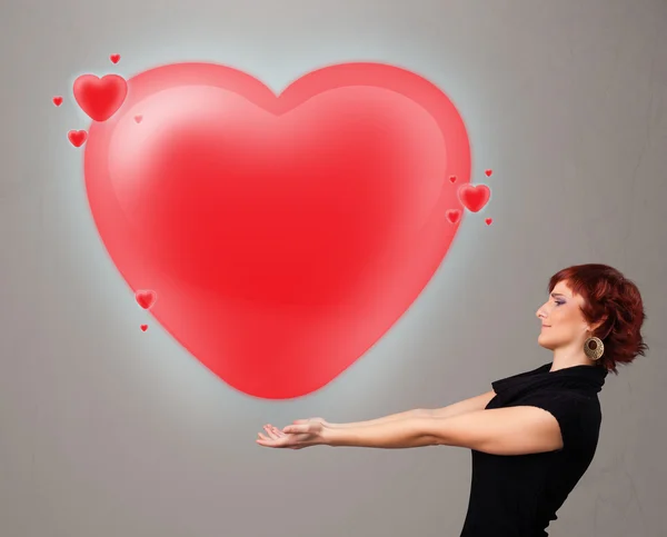 Ung dam med underbart 3d rött hjärta — Stockfoto