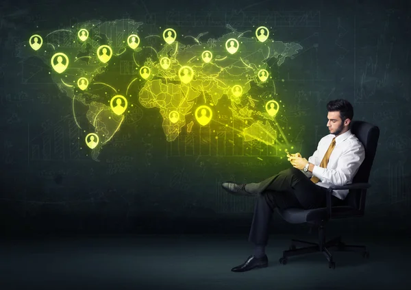 Businessman in office with tablet and social network world map — Stock Photo, Image