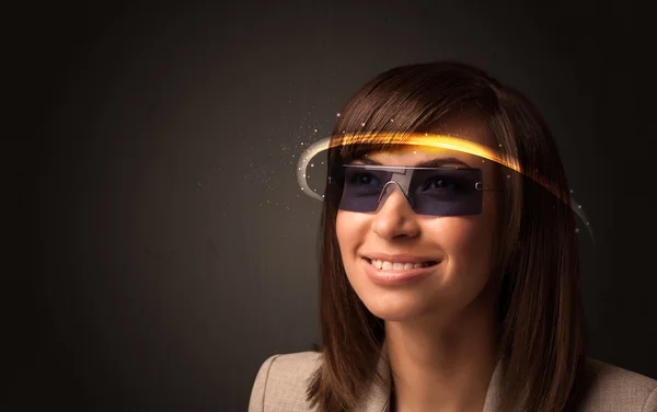 Pretty woman looking with futuristic high tech glasses — Stock Photo, Image