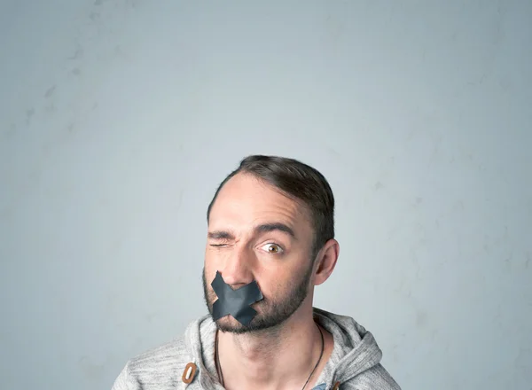 Young man with glued mouth — Stock Photo, Image