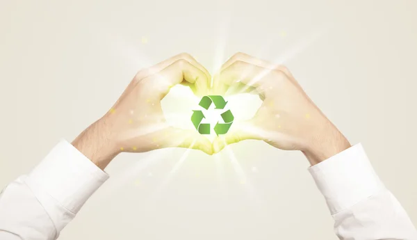 Hands creating a form with recycling sign — Stock Photo, Image