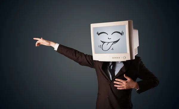 Uomo d'affari felice con un monitor del computer e una faccia sorridente — Foto Stock