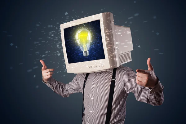 Business man with a pc monitor head and idea light bulb in the d — Stock Photo, Image