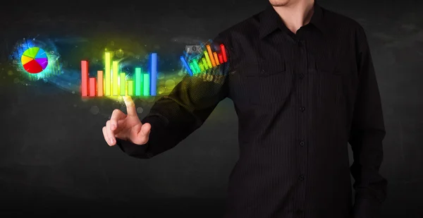 Knappe jonge zakenman aanraken van kleurrijke moderne grafiek syste — Stockfoto