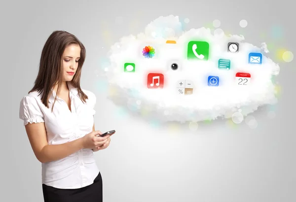 Young woman presenting cloud with colorful app icons and symbols — Stock Photo, Image