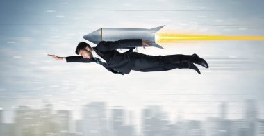 Superhero business man flying with jet pack rocket above the cit clipart