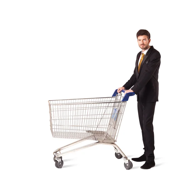 Empresário com carrinho de compras — Fotografia de Stock