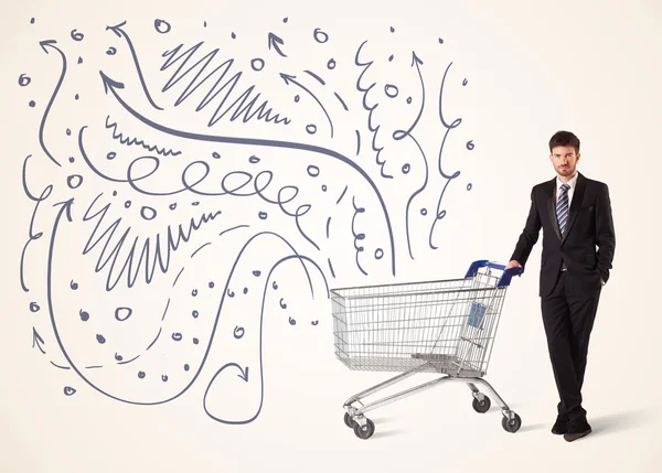 Businessman with shopping cart — Stock Photo, Image