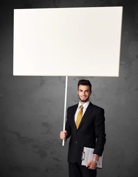 Businessman with blank whiteboard — Stock Photo, Image