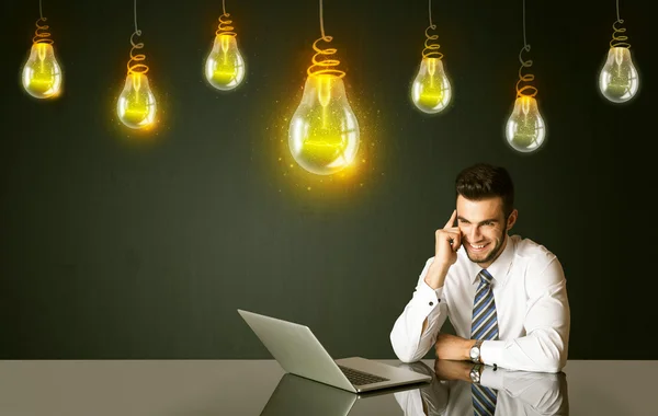 Businessman with idea bulbs — Stock Photo, Image