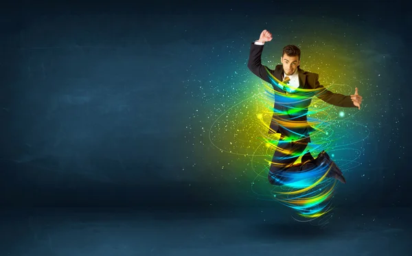 Homme d'affaires excité sautant avec des lignes colorées d'énergie — Photo