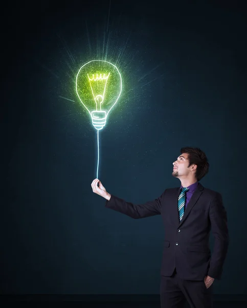 Businessman with an idea bulb — Stock Photo, Image