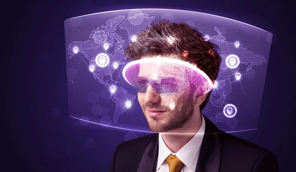 Young man looking at futuristic social network map — Stock Photo, Image