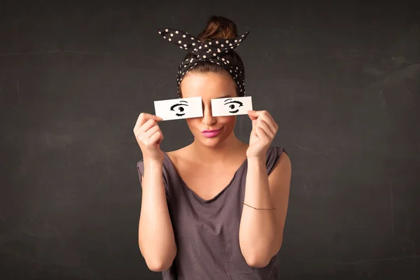 Silly youngster looking with hand drawn eye paper — Stock Photo, Image