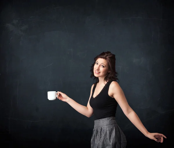 Businesswoman holding a white cup — Stock Photo, Image