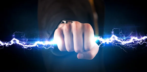 Business man holding electricity light bolt in his hands — Stock Photo, Image