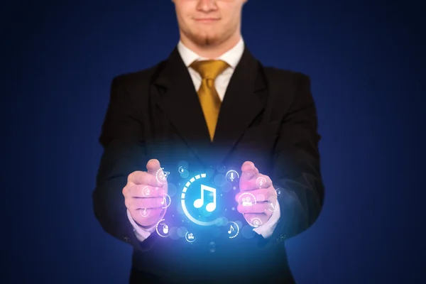 Man holding digital multimedia icons — Stock Photo, Image