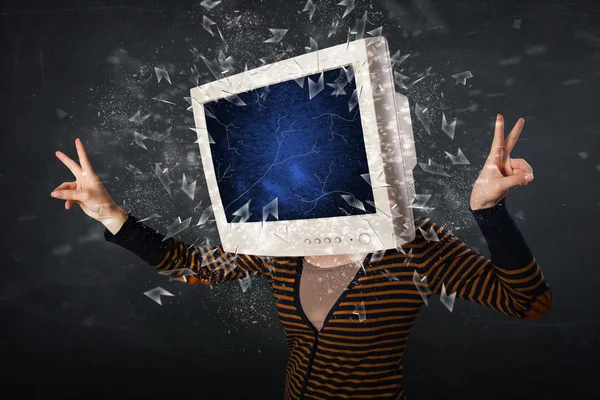 Computer monitor screen exploding on a young persons head — Stock Photo, Image