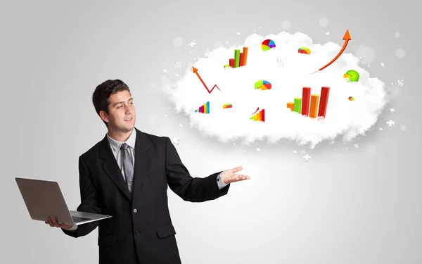 Young man presenting cloud with graphs and charts — Stock Photo, Image