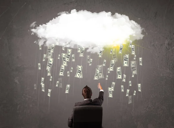 Business man in suit looking at cloud with falling money — Stock Photo, Image