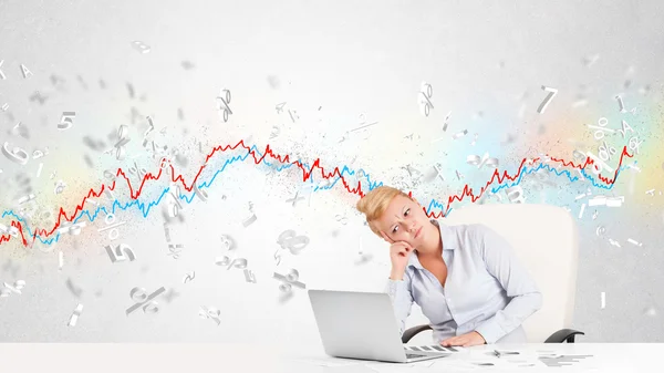 Business woman sitting at table with stock market graph — Stock Photo, Image