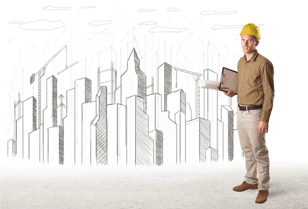 Ingenieur Mann mit Baustadtzeichnung im Hintergrund — Stockfoto
