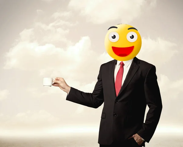 Businessman wears yellow smiley face — Stock Photo, Image