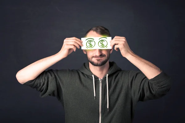 Chlap drží papír s ručně kreslenou znak dolaru — Stock fotografie