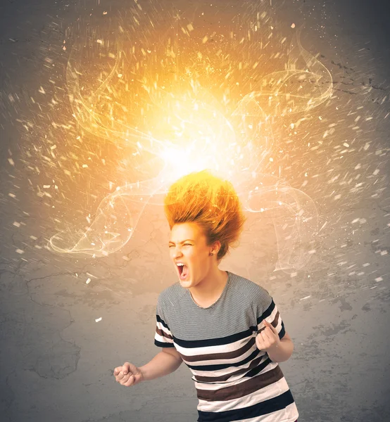 Young woman with energetic exploding red hair — Stock Photo, Image