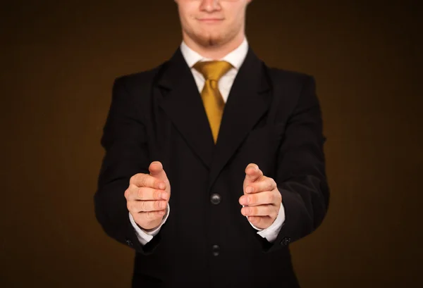 Businessman holding something — Stock Photo, Image