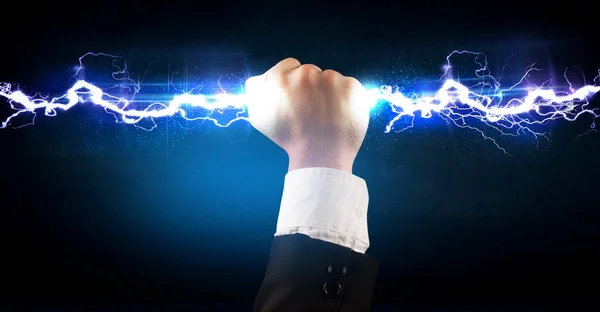 Business man holding electricity light bolt in his hands — Stock Photo, Image