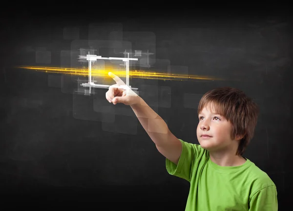 Young tech boy touching button with orange light beams concept — Stock Photo, Image