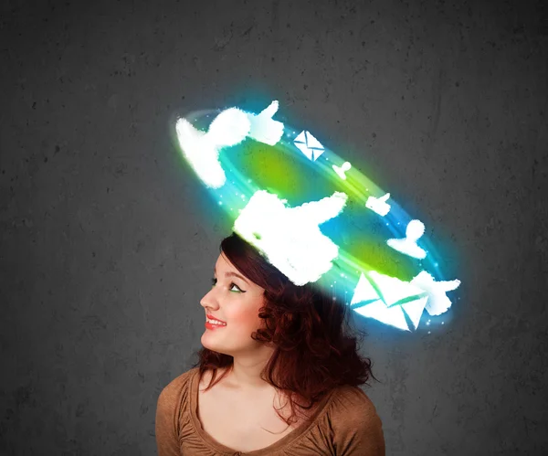 Young teenager with cloud social icons around her head — Stock Photo, Image