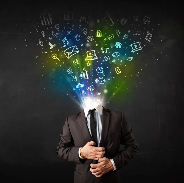 Business man with glowing media icons exploding head — Stock Photo, Image