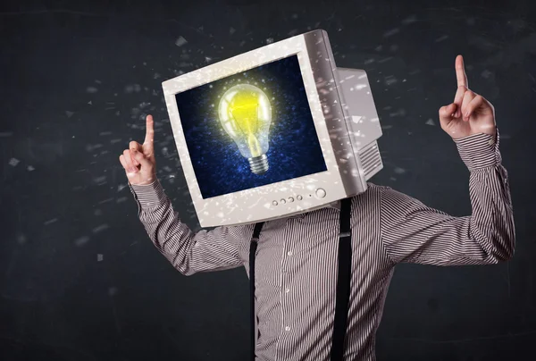 Business man with a pc monitor head and idea light bulb in the d — Stock Photo, Image